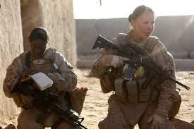 Rearview of a patriotic female soldier standing in front of her home with her luggage. Courageous servicewoman coming back home after serving her country in the military.