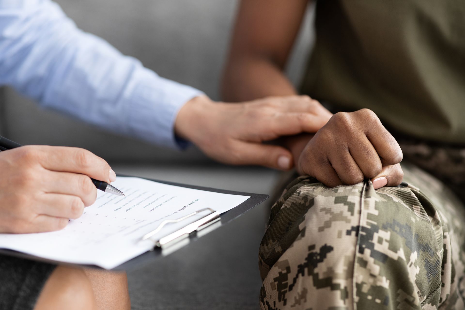 Closeup Shot Of Psychotherapist Supporting African American Soldier Woman During Therapy Session In Office, Unrecognizable Psychologist Lady Comforting Black Military Female In Uniform, Cropped.