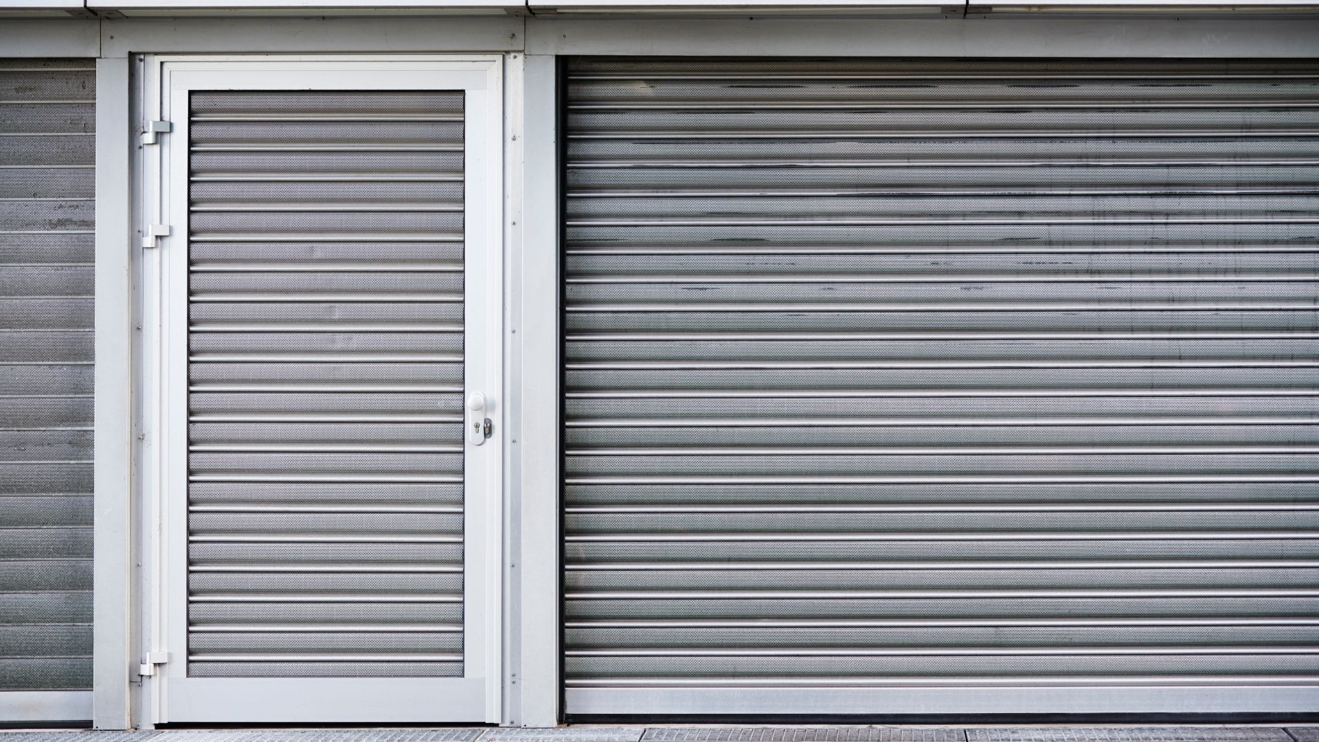 Brown wooden garage door with windows.