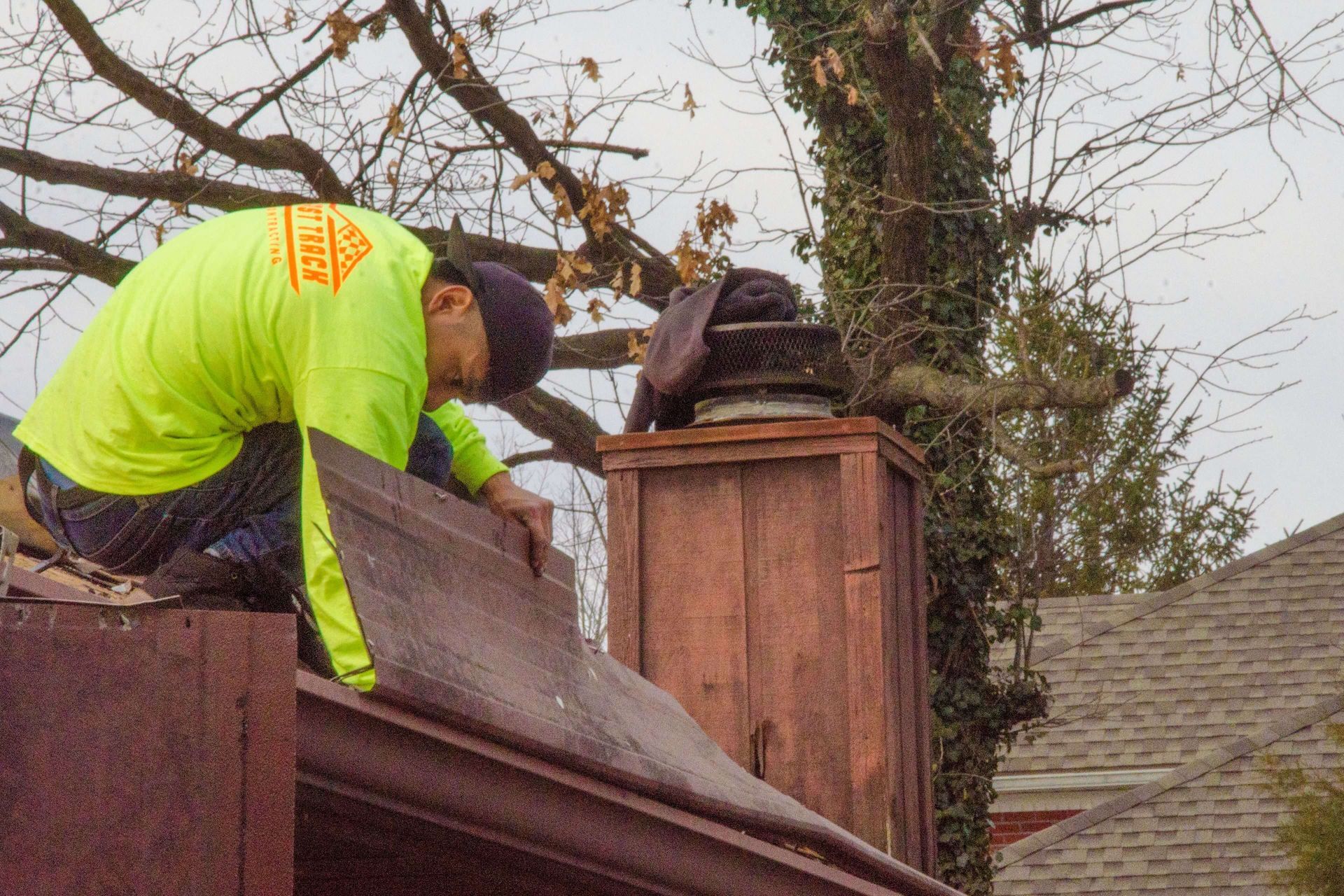 Photo of a residential roof being replaced by Fast Track Contracting