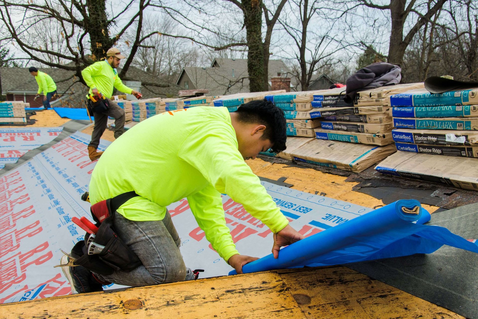 Photo of Fast Track Contracting installing new roof shingles to a residential home 