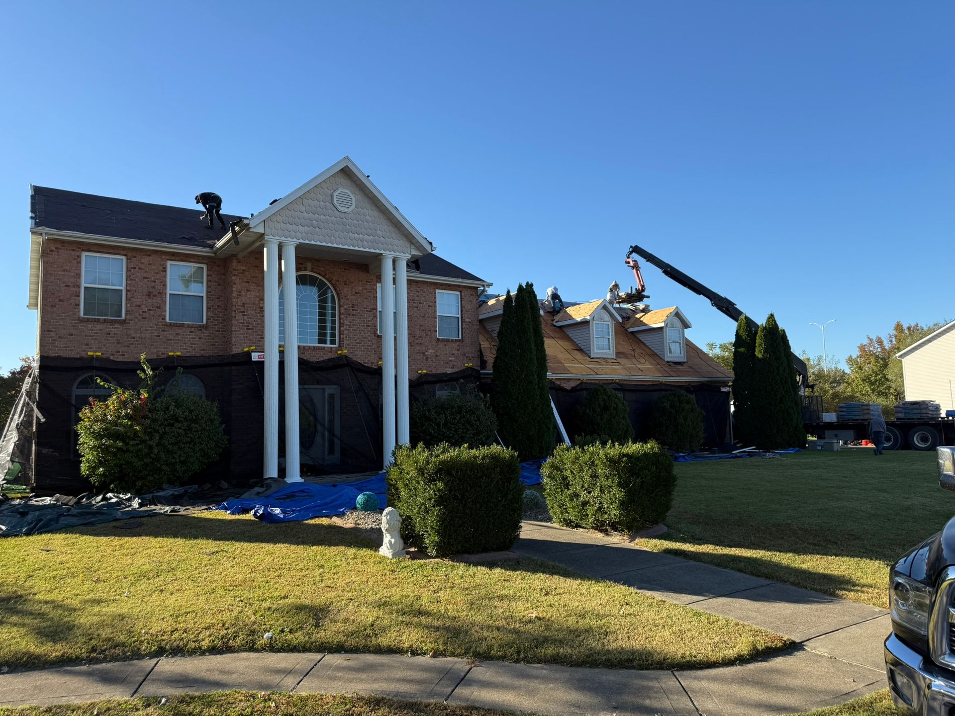 photo of Fast Track Contracting working replacing a roof in the Belleville IL area