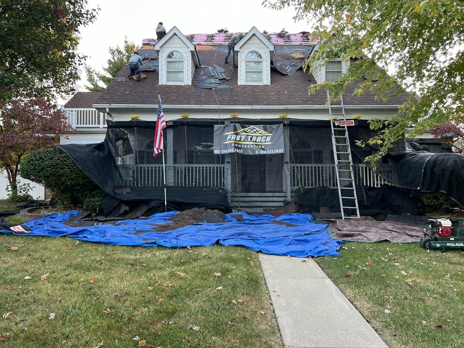 Photo of Fast Track Contracting working on a storm damaged roof
