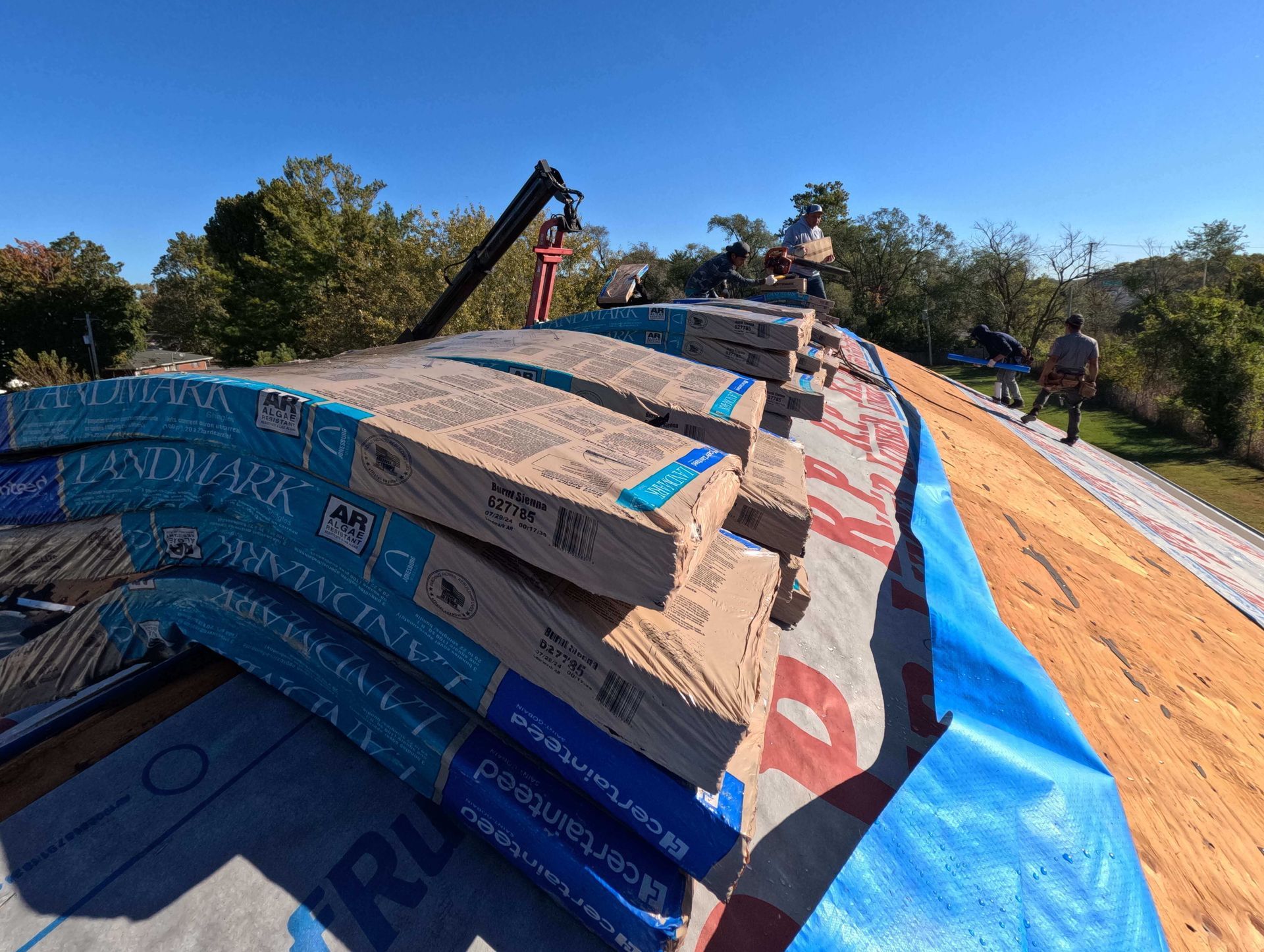 Photo of Fast Track Contracting installing a new roof on a residential home