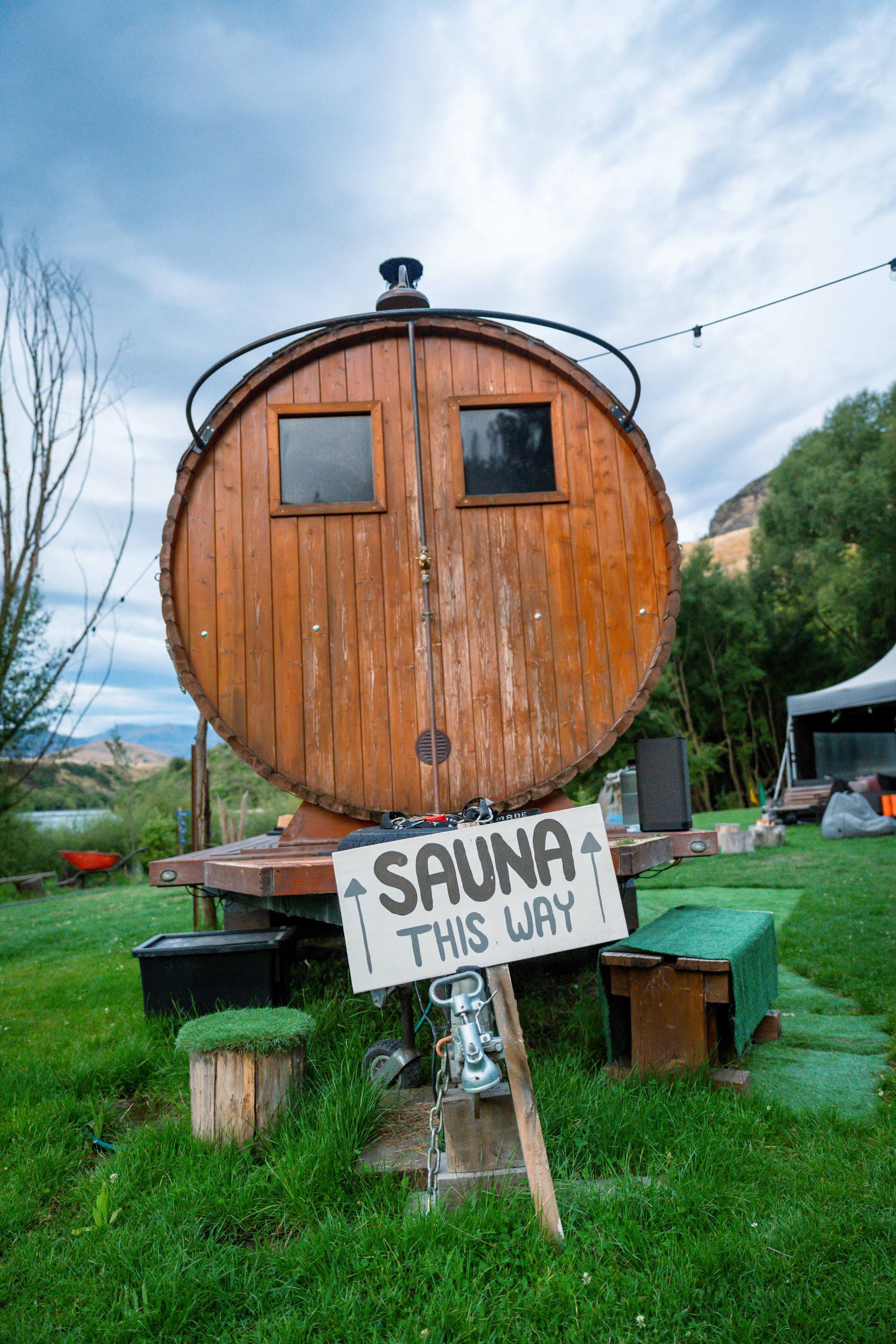 Barrel-shaped sauna with a sign that reads 