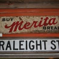 Merita bread sign above a Raleigh Street sign