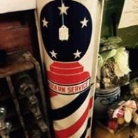 Barber pole with red, white, and blue stripes and stars, labeled “Modern Service”