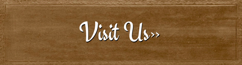 “Visit Us” text on a brown textured wooden sign