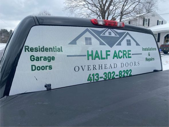 A vehicle rear window decal advertising