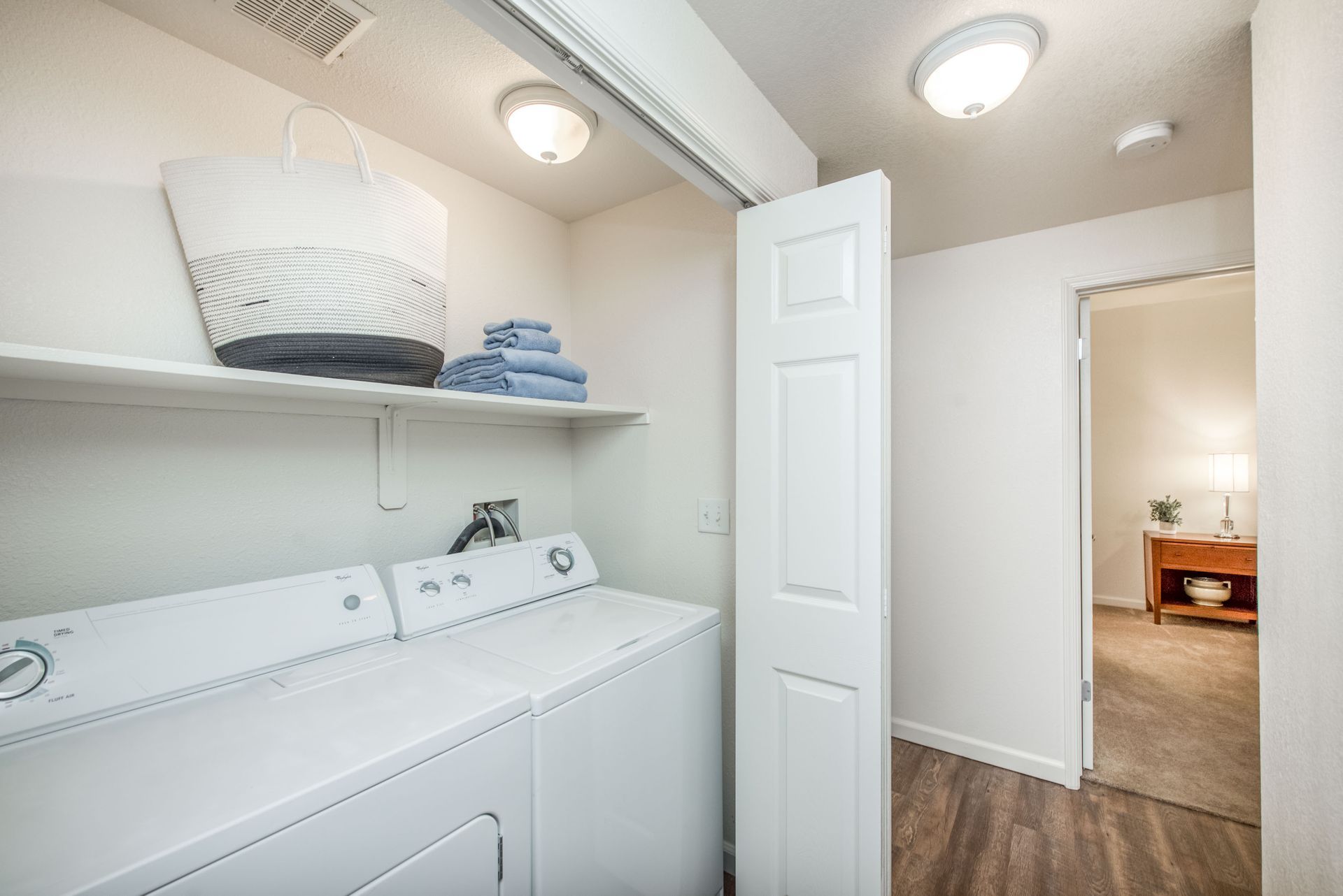 a laundry room with a washer and dryer in a house .