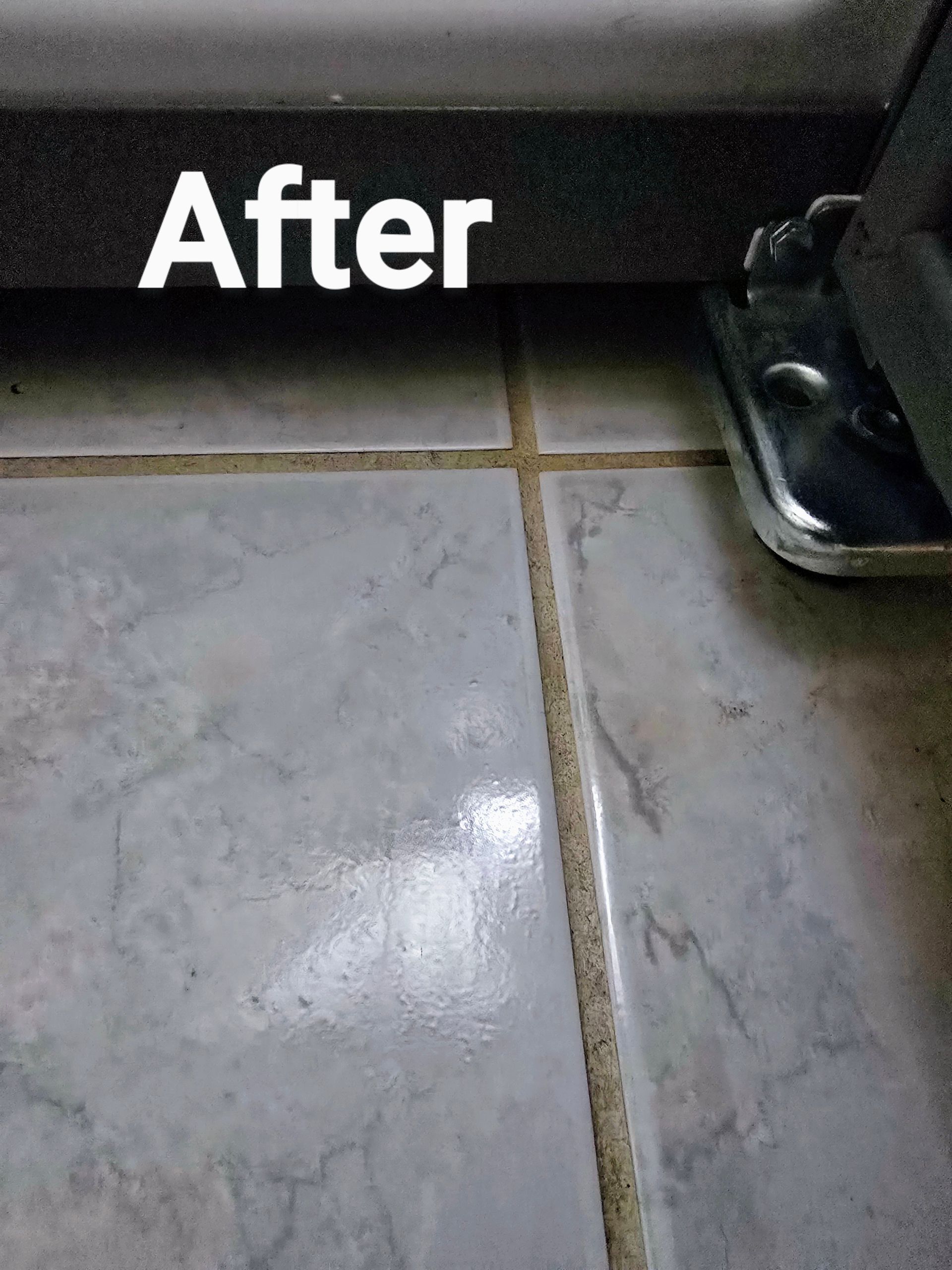 A close up of a tiled floor with the words `` after '' written on it.