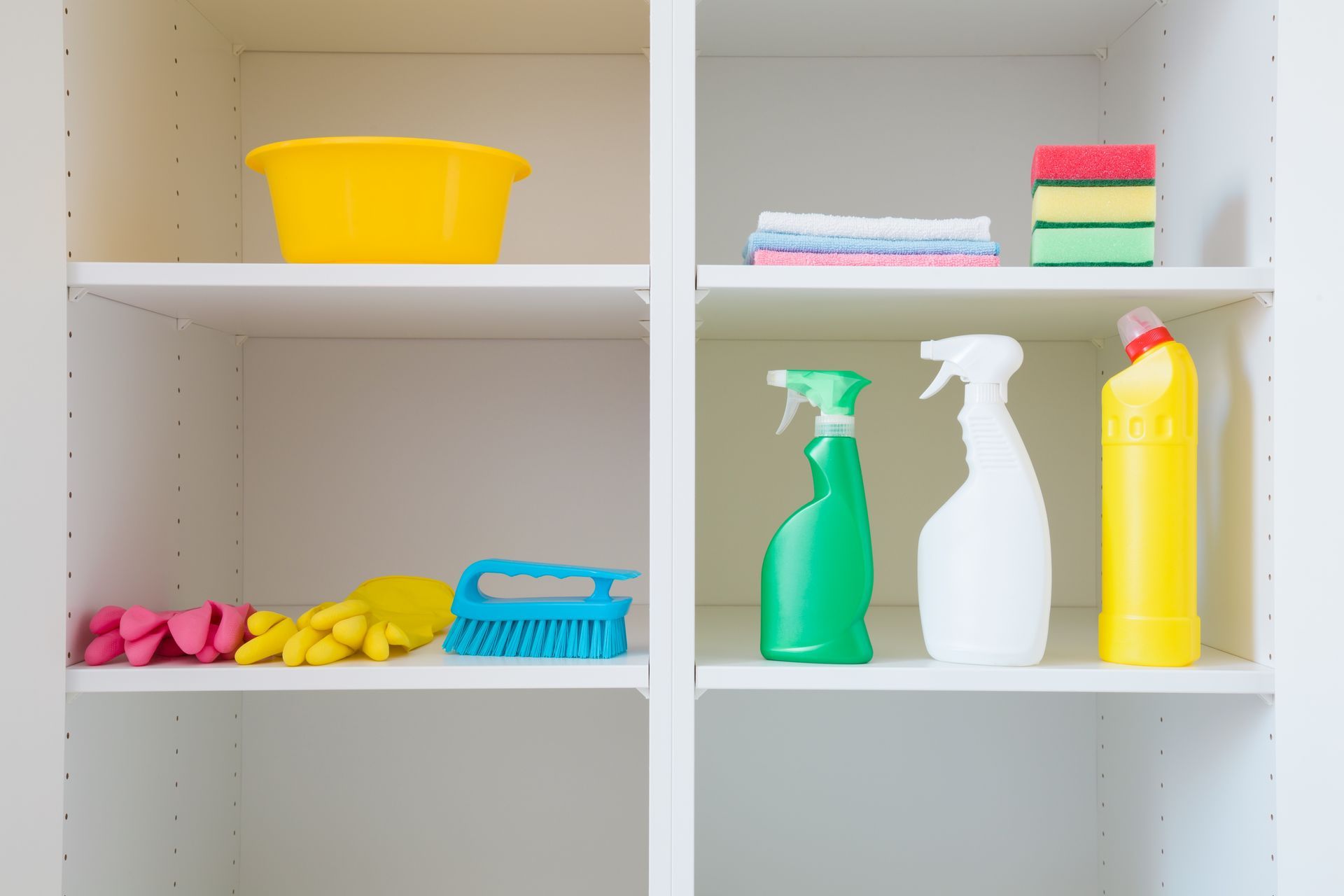 A shelf filled with cleaning supplies and a yellow bowl.