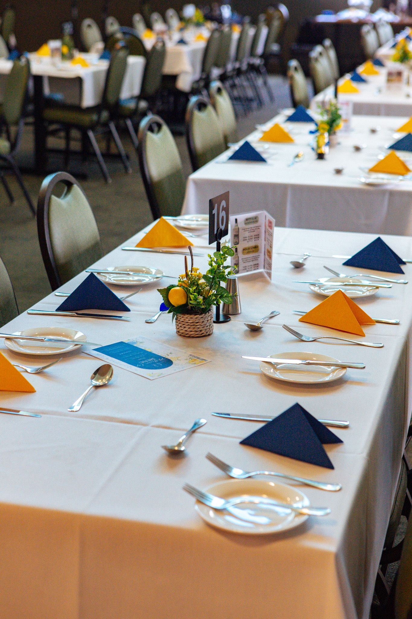 A large dining room with tables and chairs and a tv on the wall at Para Hills Community Club