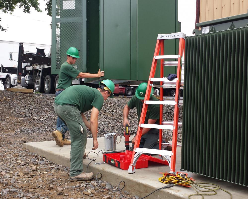 Workers Repairing the Machine — Chalfont, PA — Lift Tech Crane and Rigging