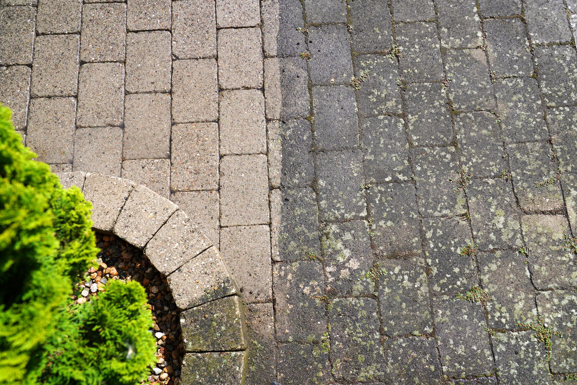 A before and after picture of a brick walkway.