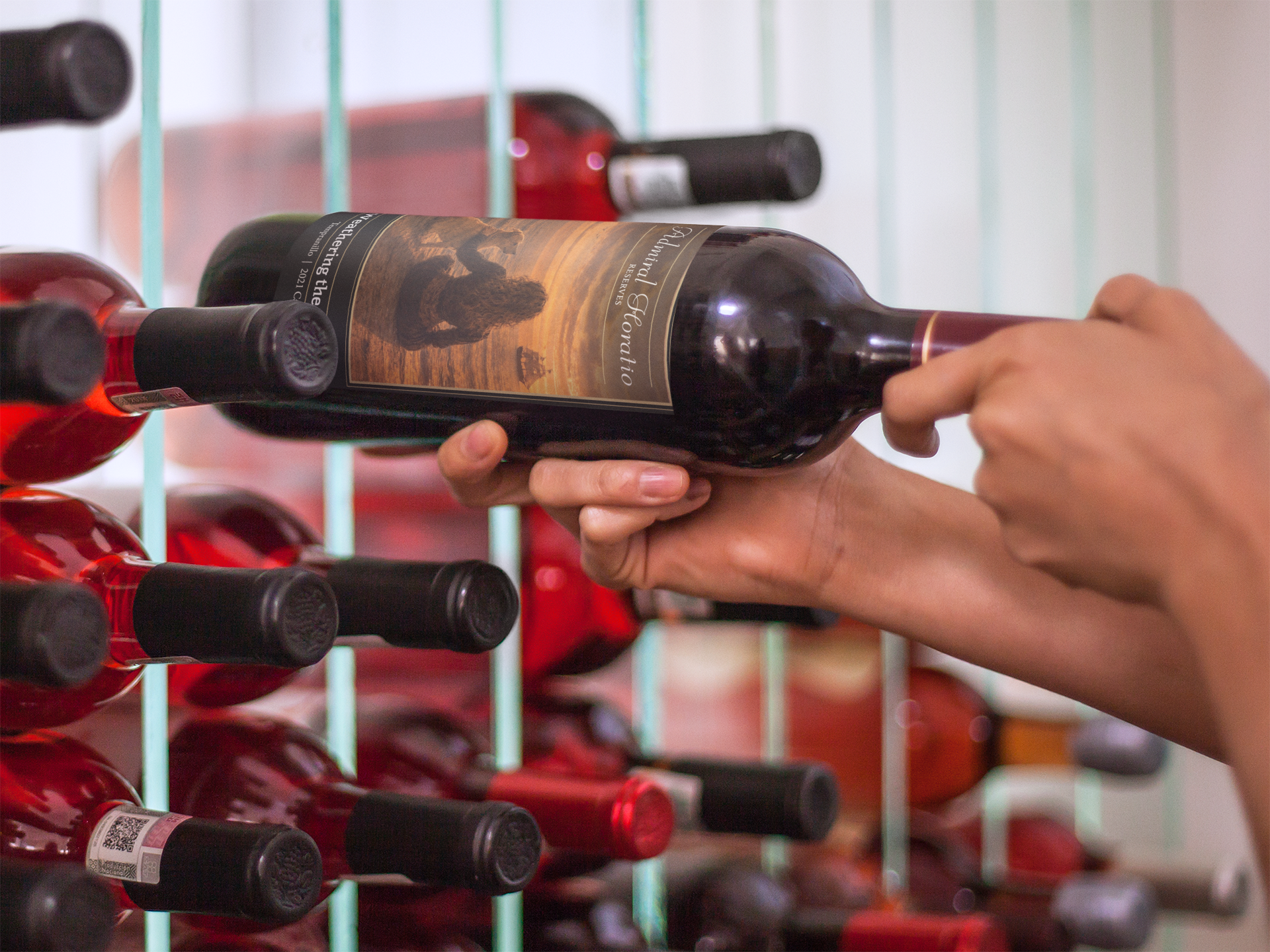Hands placing a wine bottle into a wall-mounted wine rack among other bottles.