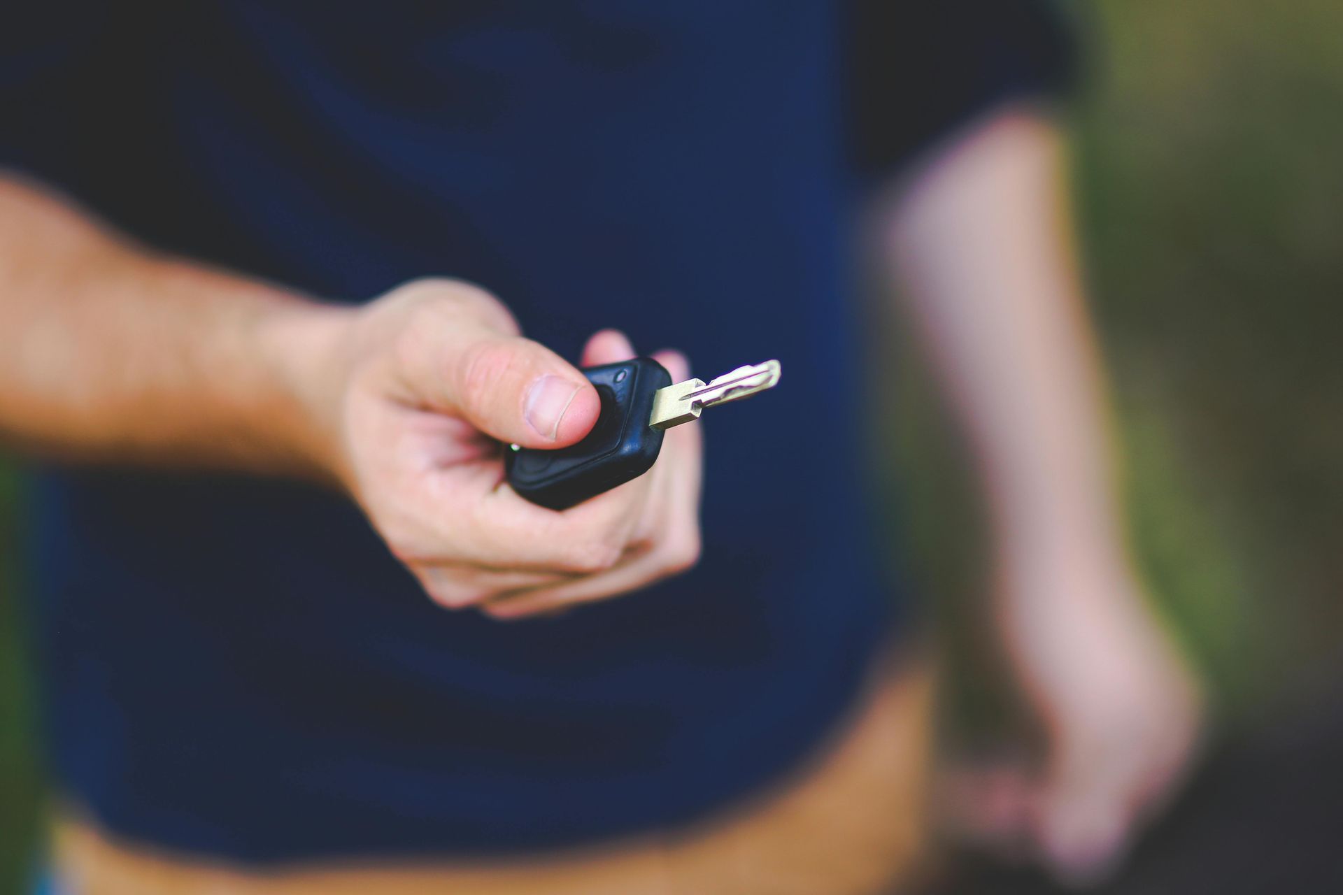 Person Holding Key FOB Not Working