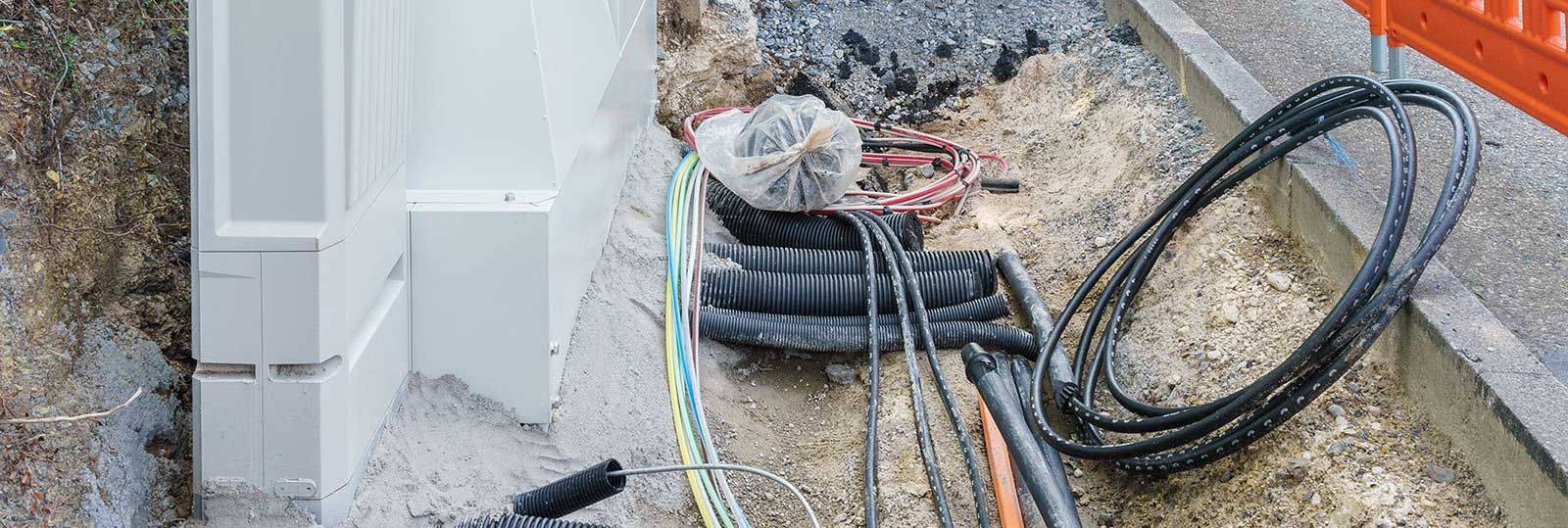 A bunch of wires are laying on the ground.