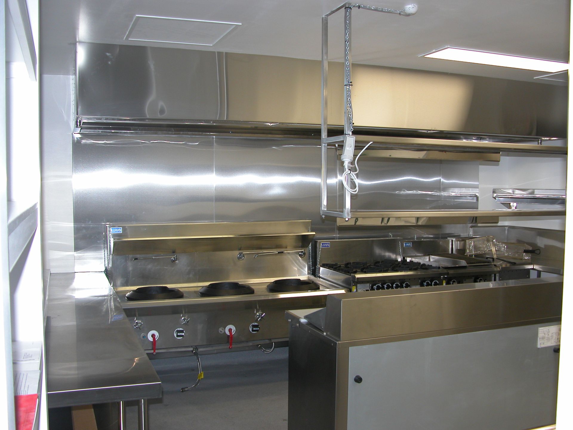 A kitchen with stainless steel appliances including a stove