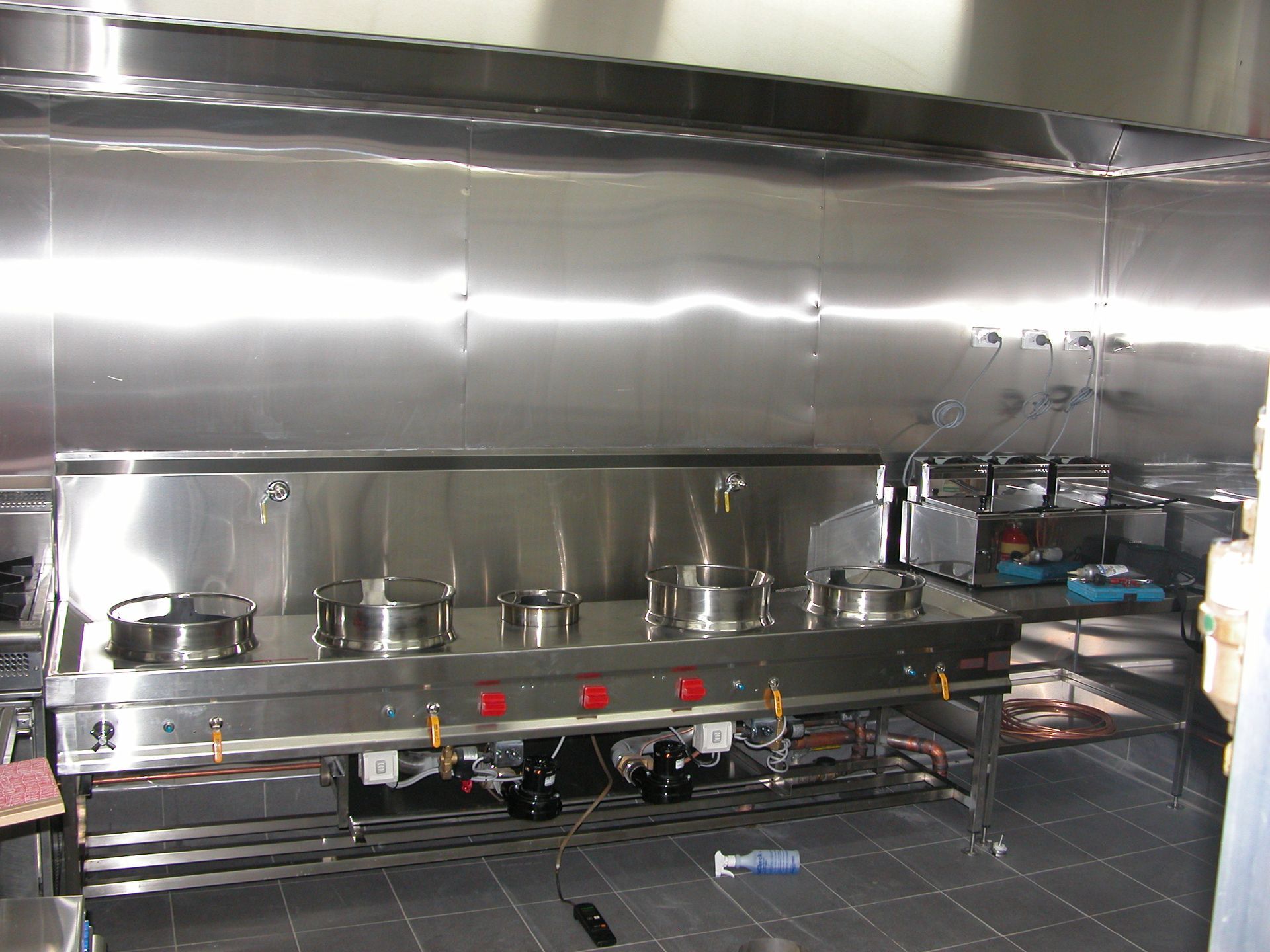A kitchen with stainless steel appliances and a sink.