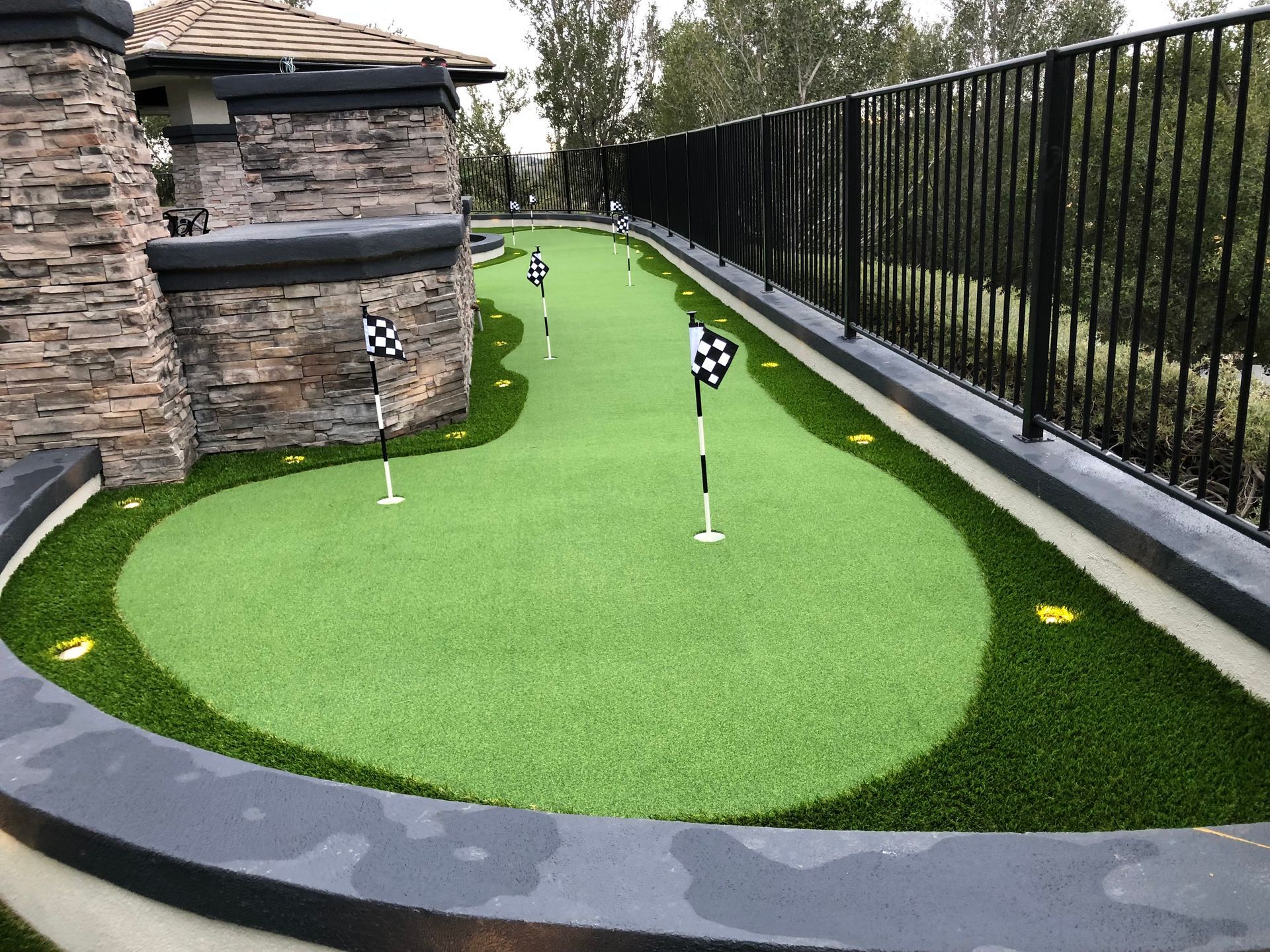 long, narrow synthetic putting green HH