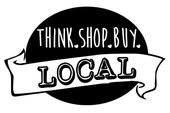 Black-and-white “Think. Shop. Buy. Local.” sign with banner and bold “LOCAL” text