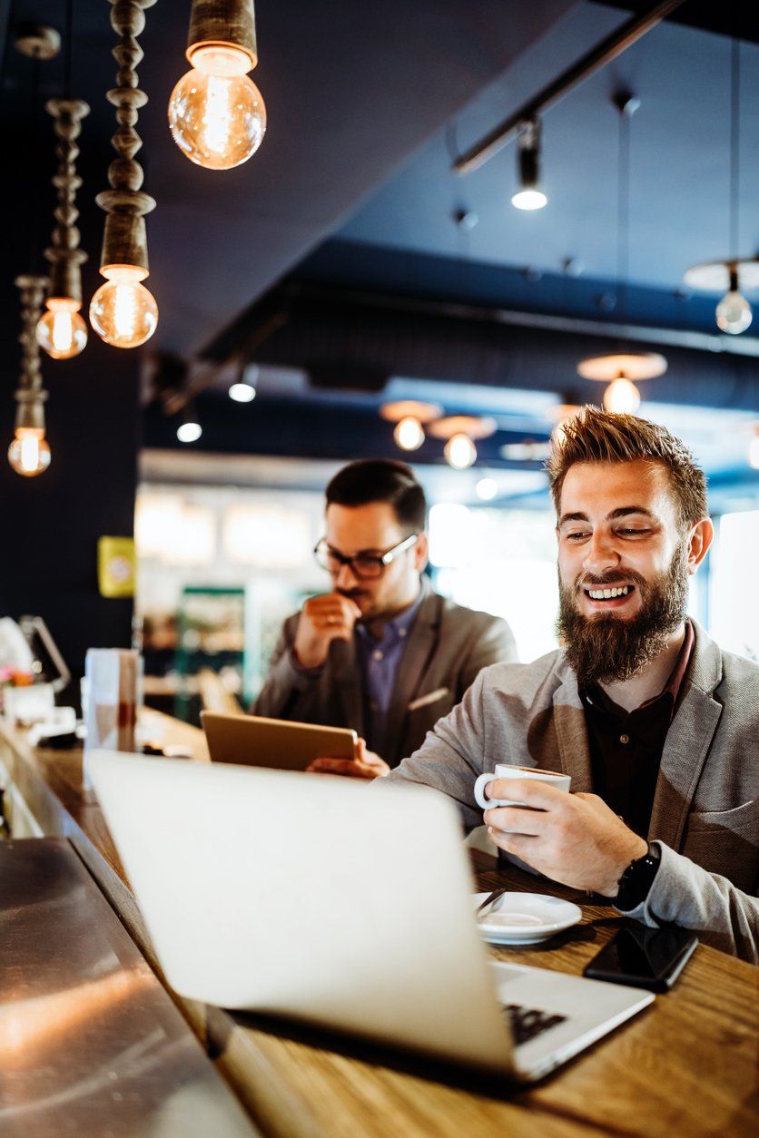 Satisfied client filing taxes in Texas coffee shop