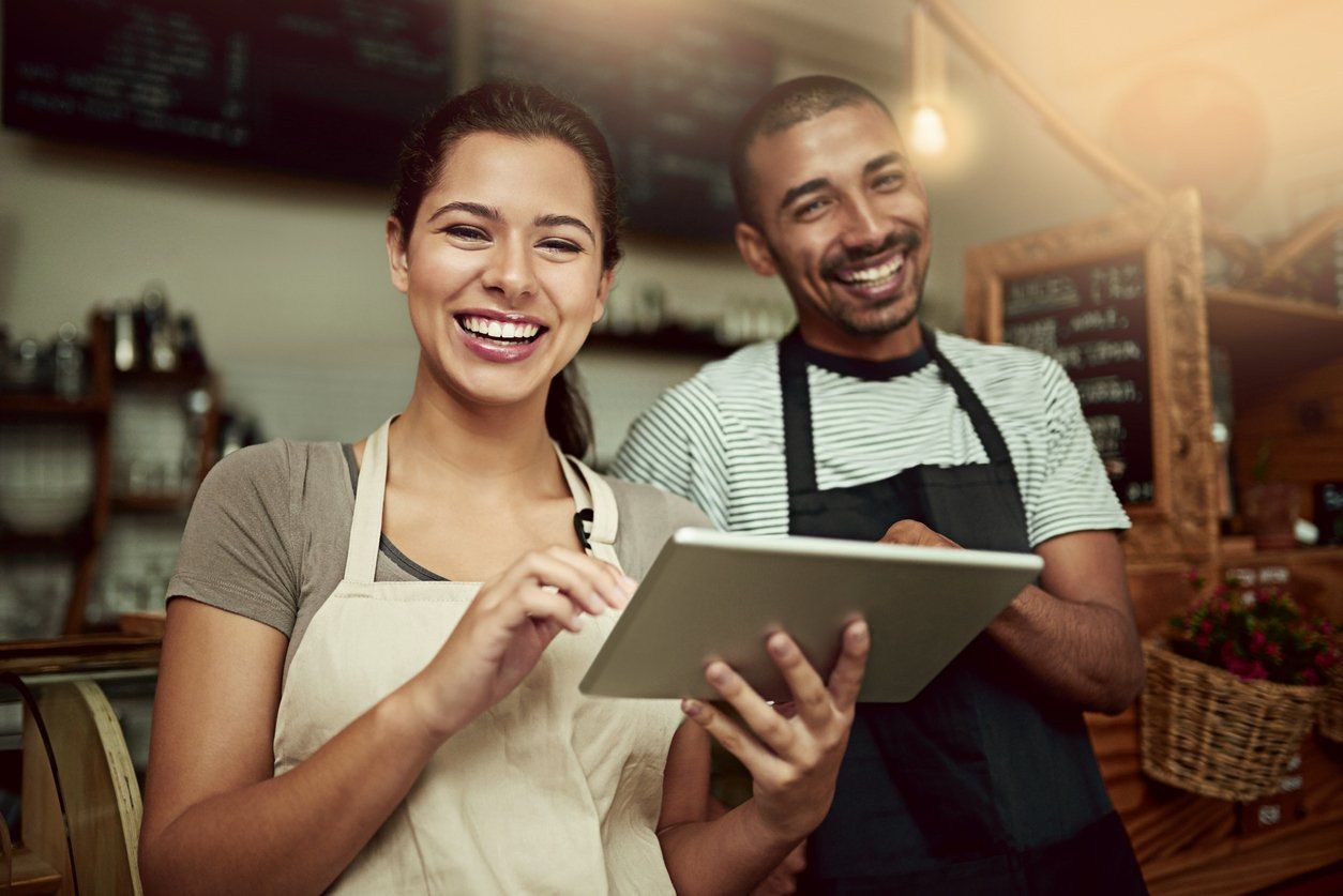 Two smiling business owners in McKinney Texas