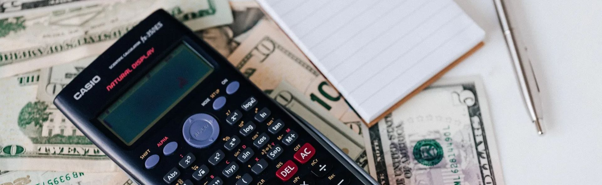 Calculator on a pile of money