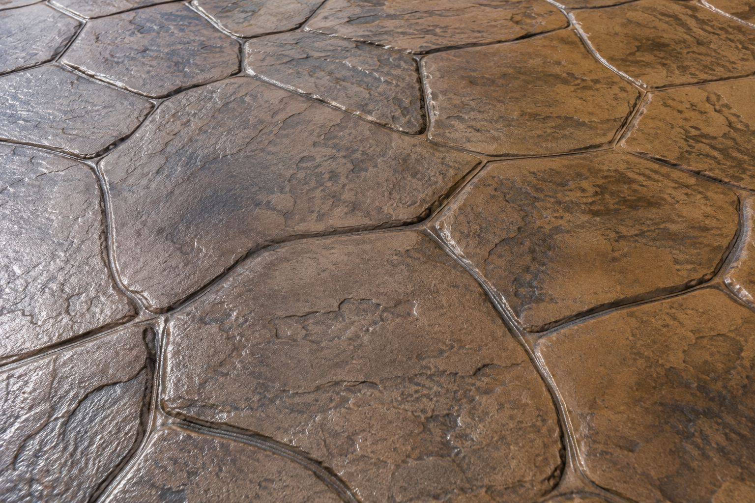 A close up of the stamped and stained concrete on a back porch