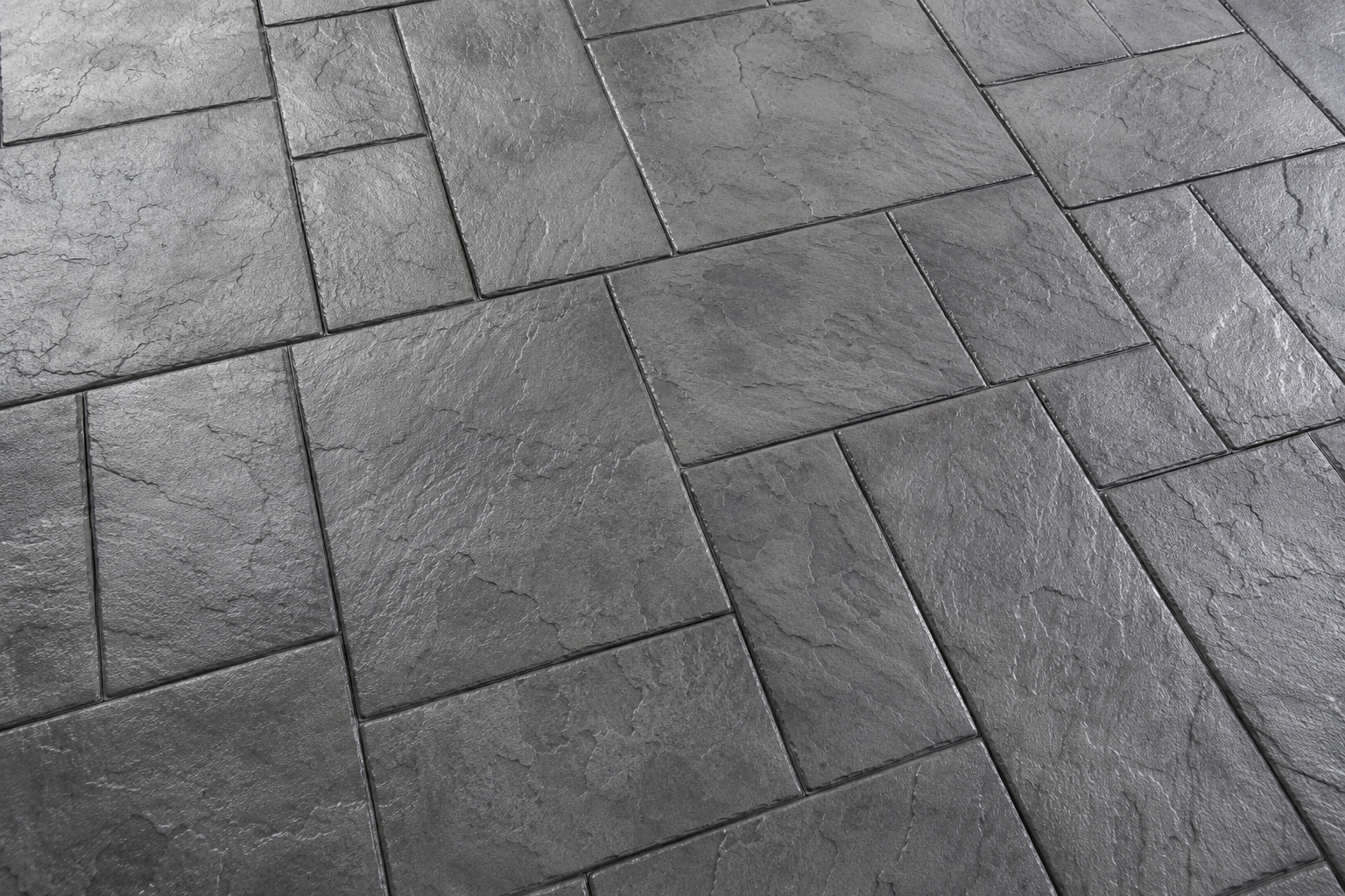 A close up of the stamping pattern on a concrete sidewalk