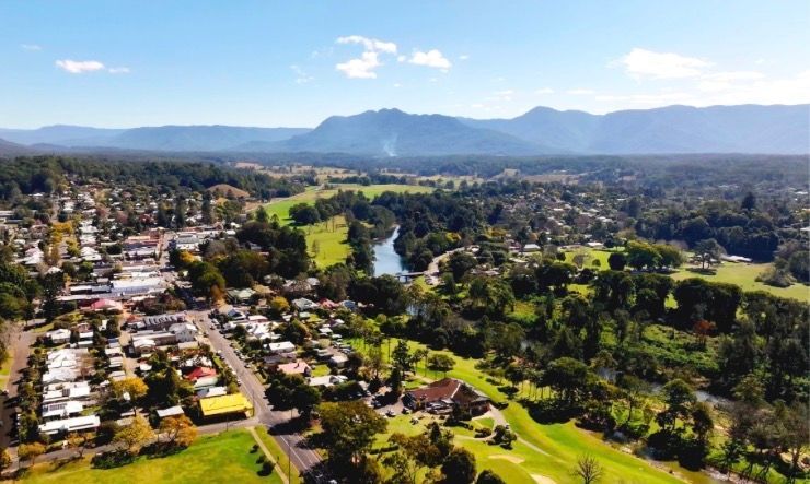 Aerial View of a Wide Blue River, With Houses on the Banks — Vedic Meditation & Coherence Personal Counselling in Grafton, NSW