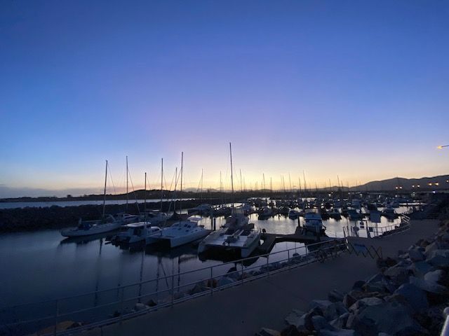 Many sailboats docked at a marina during a soft twilight sunset — Vedic Meditation & Coherence Personal Counselling in Coffs Harbour, NSW