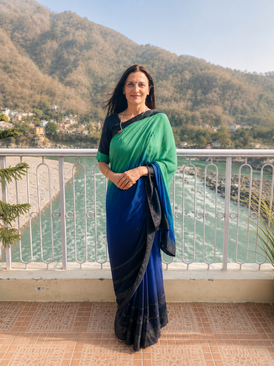 A Woman In A Blue And Green Saree Standing On A Balcony — Vedic Meditation in Coffs Harbour, NSW
