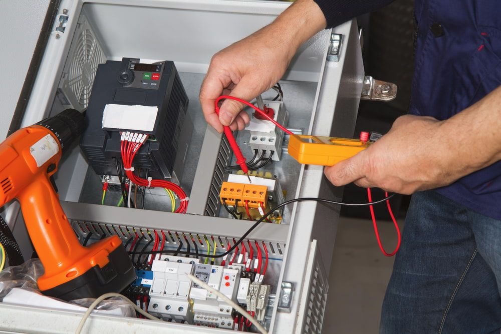 Hand of Repairman Fixing Appliance — Appliance Repairs in Mackay, QLD