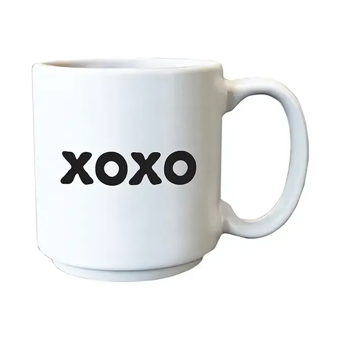 White mug with “xoxo” in black text