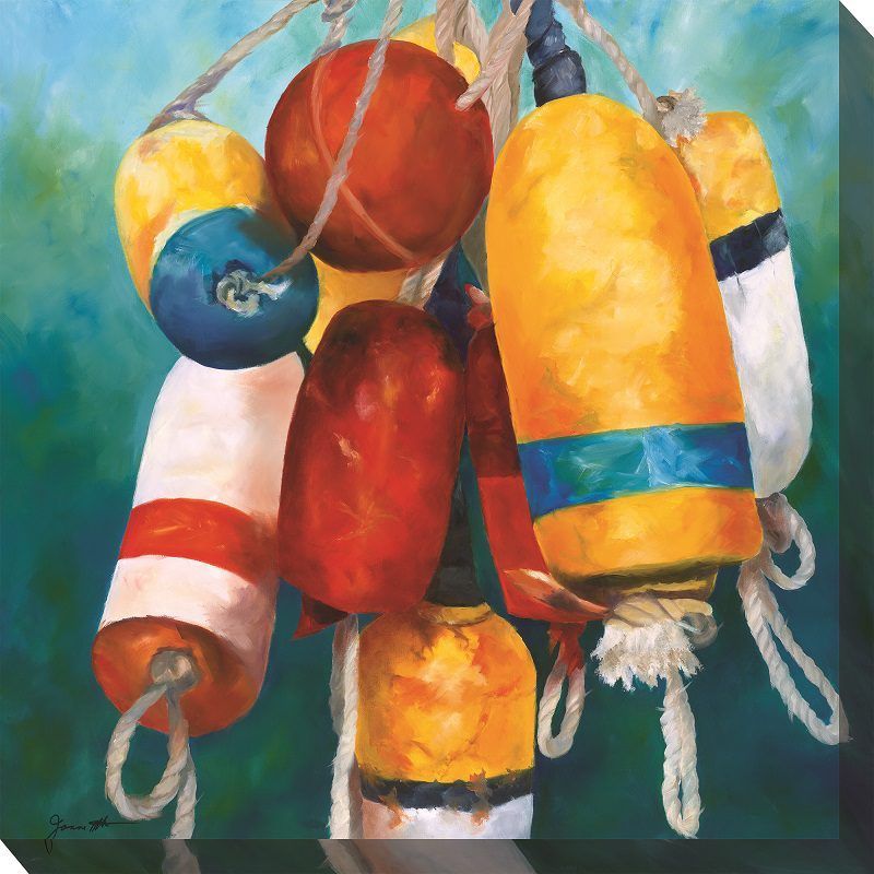 Colorful cluster of painted fishing buoys and floats hanging against a blue background