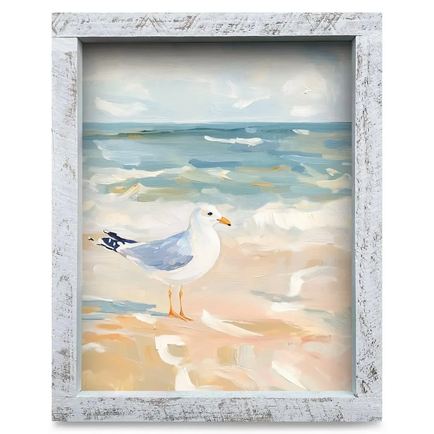 Framed watercolor of a white seagull standing on a sandy beach by blue ocean waves.
