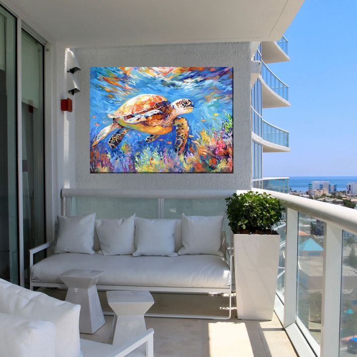 Tropical patio lounge with woven sofas, coffee table, and open ocean view at sunset.