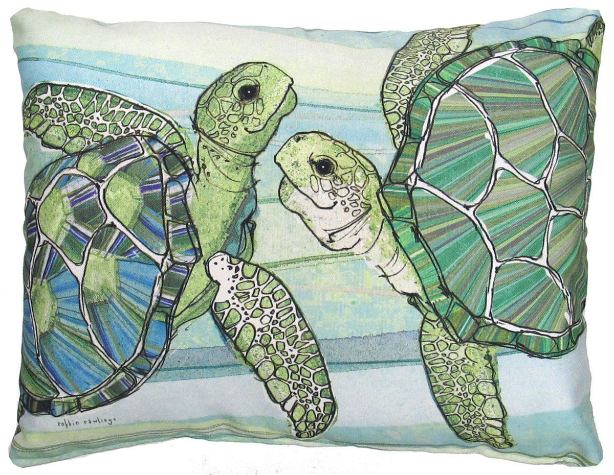 Three sea turtles on a blue striped pillow, with two large green shells and a smaller turtle in the center