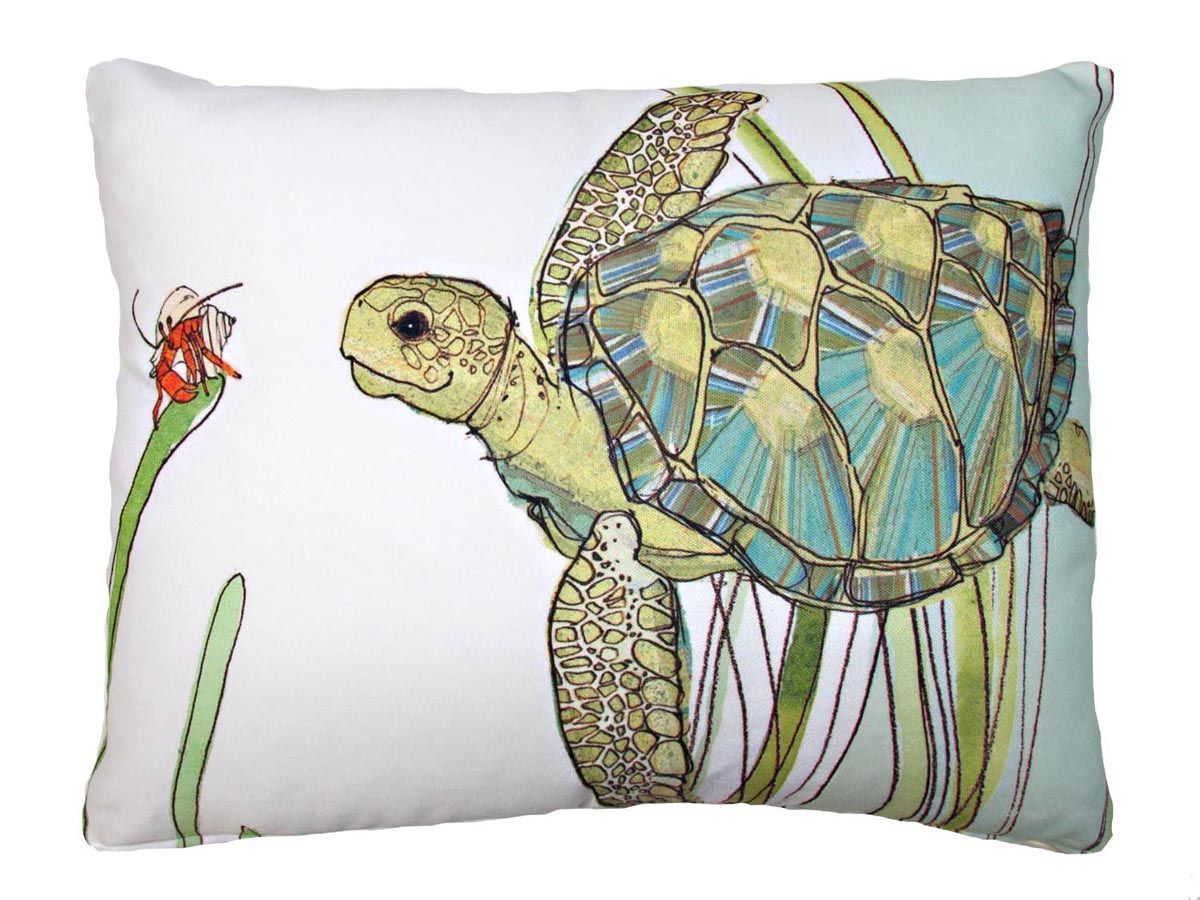 Turtle pillow with a small red flower and green stems on a white background