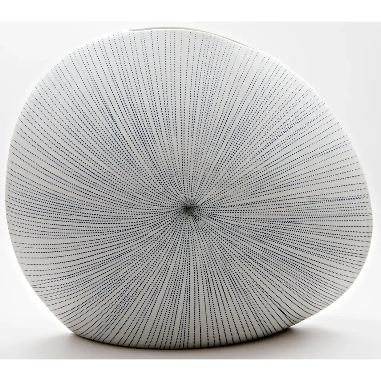 A round white cushion with fine black dotted lines, centered on a plain light background.