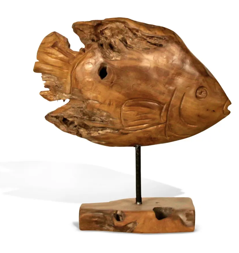 Wooden fish sculpture on a black stand with a small wooden base, isolated on white.