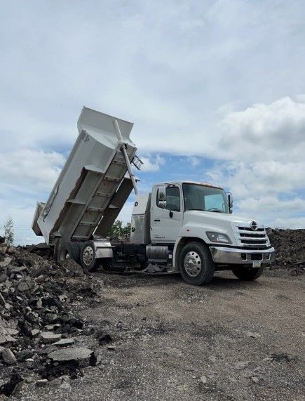 Dump Truck filled with Rocks - Cedar Rapids, IA - Venture Concrete & Excavating LLC
