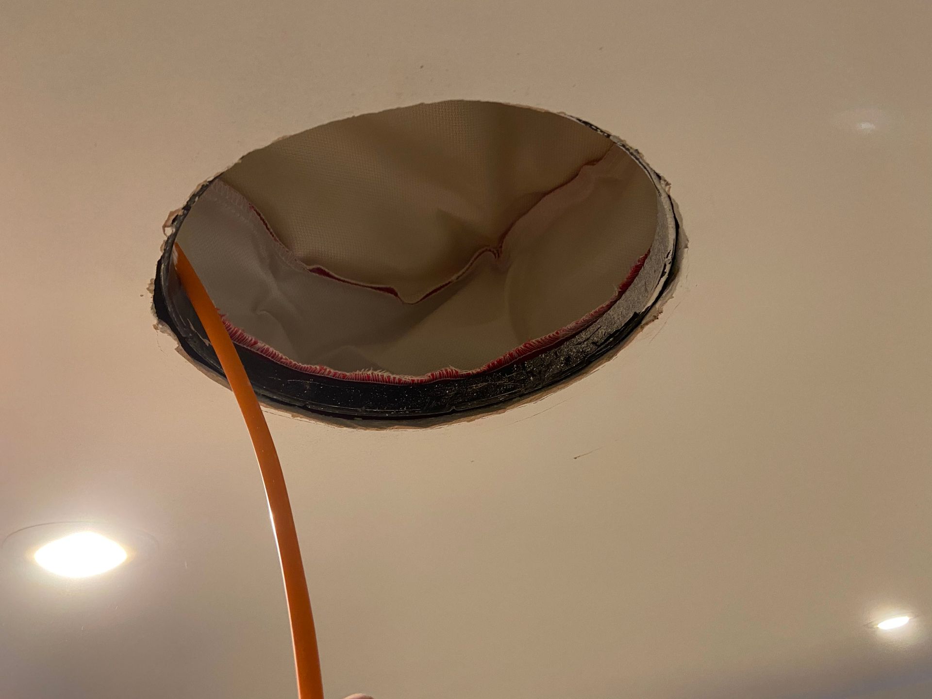 Speaker firehood installed in ceiling void prior to speaker being installed