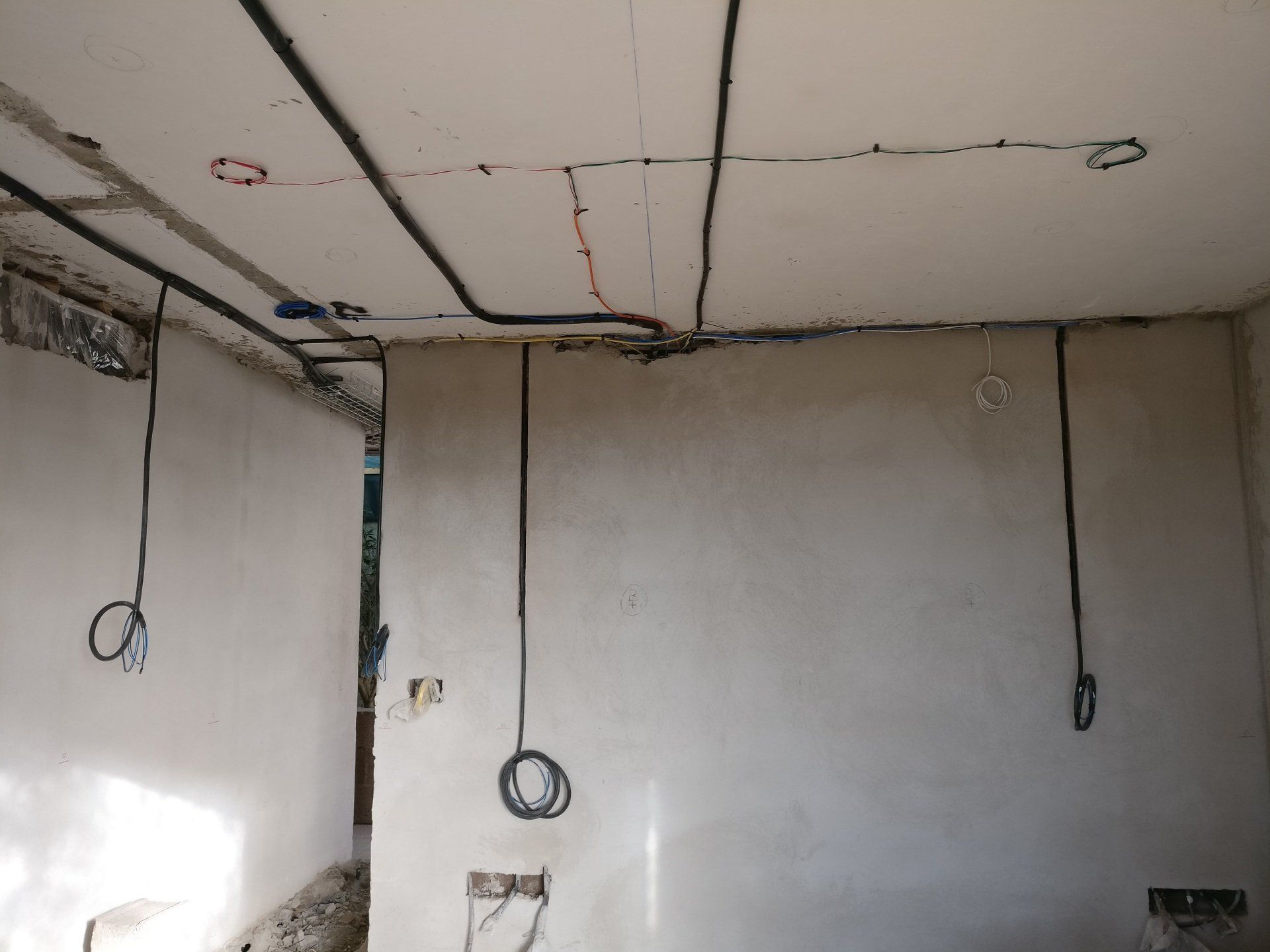 1st fix cabling installed into walls and ceiling prior to the walls being plastered