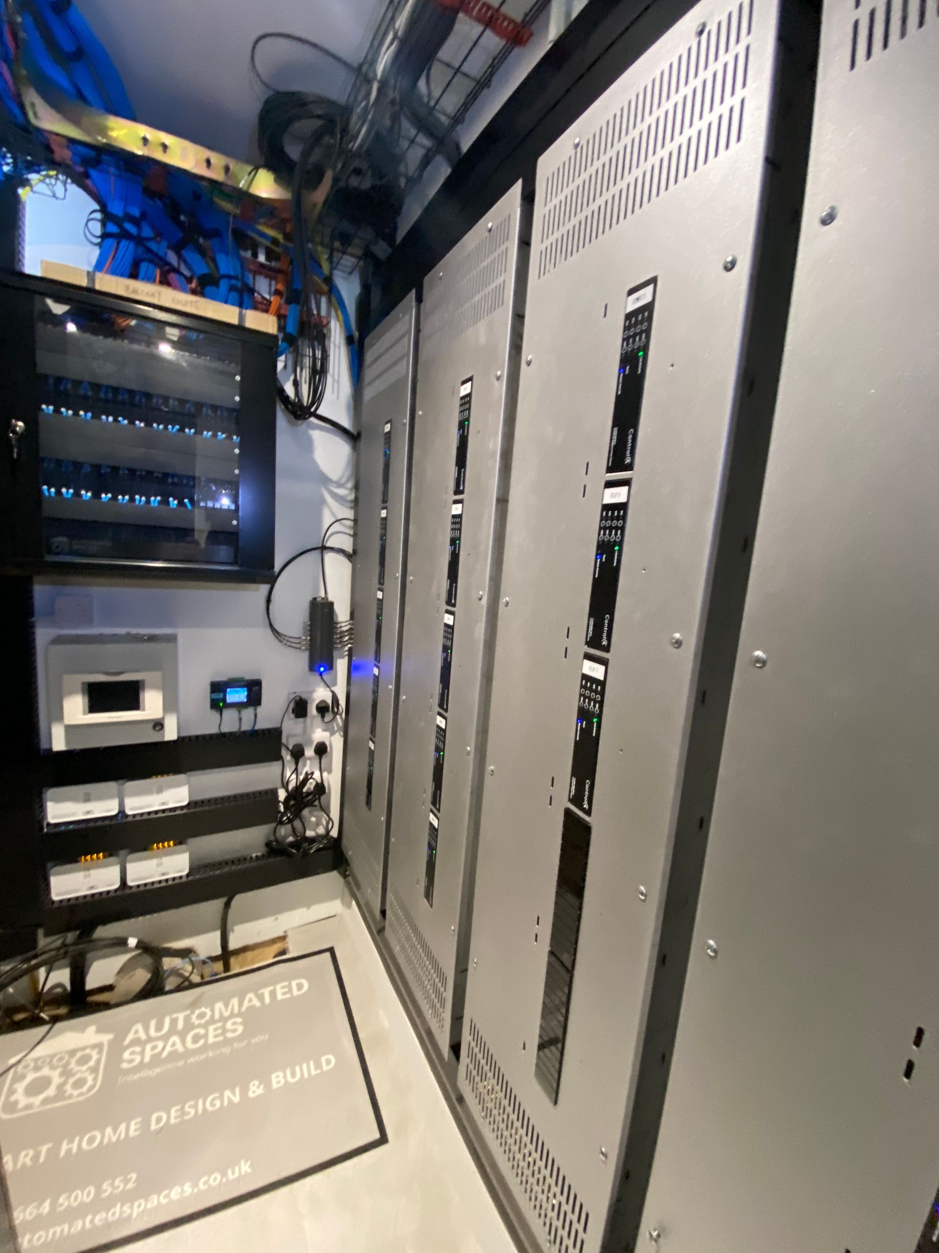 Photo of Patch panel, smart lighting panels, TV antenna splitter, air con control panel, heating integration system