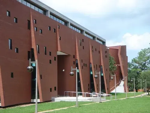 A large red brick building with a lot of windows