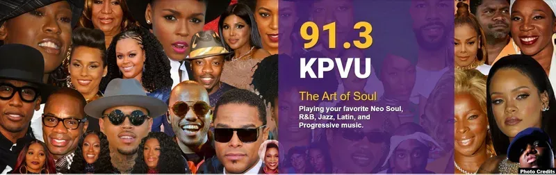 A group of people are standing in front of a sign that says 91.3 kpvu