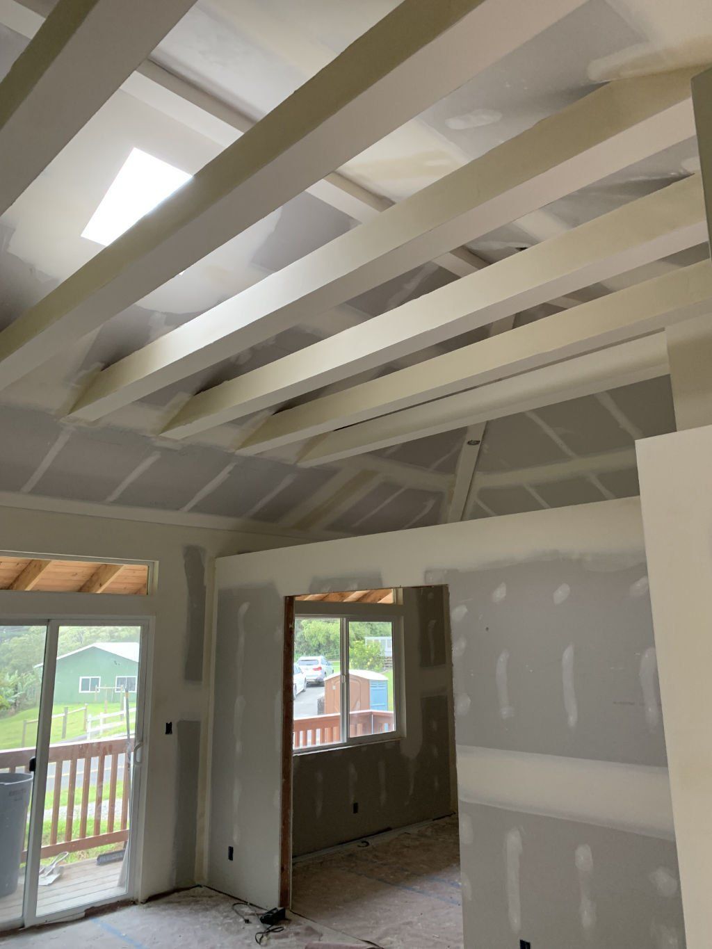 A room with a ceiling that has a lot of beams on it